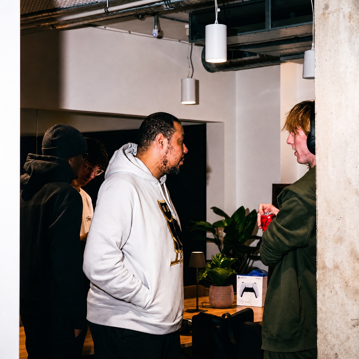 Three Juntos members in conversation at a community evening