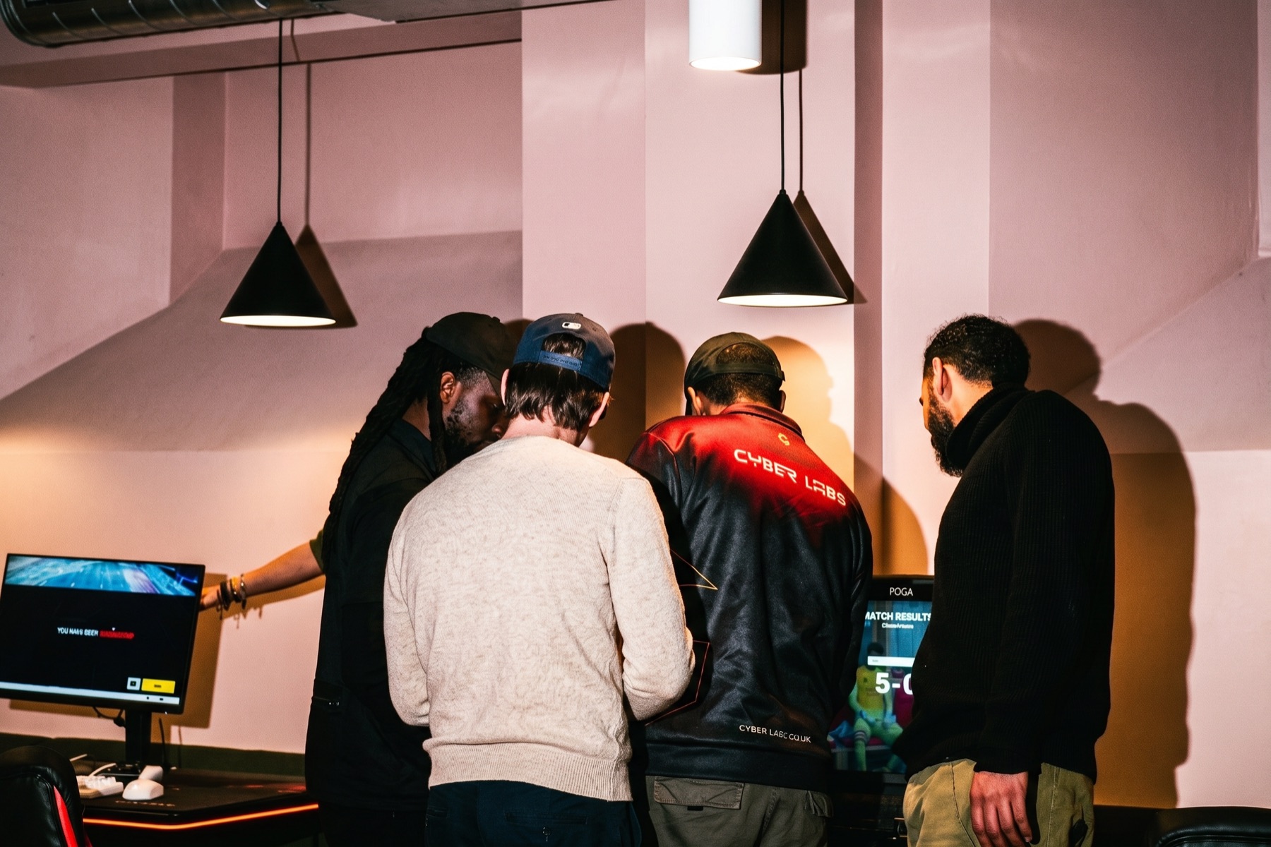 Members at a Juntos event — group gathered around the screen, laughing